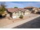 Charming single-Gathering home with a well-maintained front yard and a two car garage at 2612 W Summerside Rd, Phoenix, AZ 85041