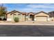 Charming single-story home featuring a well-manicured front yard and a two-car garage at 2612 W Summerside Rd, Phoenix, AZ 85041