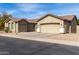 Lovely home featuring a three-car garage and low maintenance desert landscaping at 2612 W Summerside Rd, Phoenix, AZ 85041
