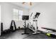 Well-equipped home gym with exercise machines and weights, providing a convenient fitness space at 2612 W Summerside Rd, Phoenix, AZ 85041