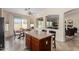 Bright kitchen features a large island with seating, a breakfast nook and stylish tile flooring at 2612 W Summerside Rd, Phoenix, AZ 85041