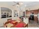 Spacious eat-in kitchen featuring a kitchen island and views into the living room at 2612 W Summerside Rd, Phoenix, AZ 85041
