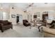Spacious living room with carpet flooring, a ceiling fan, and ample seating space at 2612 W Summerside Rd, Phoenix, AZ 85041