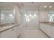 Large bathroom boasts a modern glass shower enclosure with dual shower heads and vanities at 26696 W Siesta Ln, Buckeye, AZ 85396