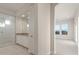 Bright bathroom with a glass-enclosed shower, dual vanity sinks, and contemporary design at 26696 W Siesta Ln, Buckeye, AZ 85396