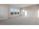 Bright and spacious bedroom with large windows offering ample natural light and scenic views at 26696 W Siesta Ln, Buckeye, AZ 85396