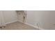 Functional laundry room showcasing modern fittings and tile flooring for convenience at 26696 W Siesta Ln, Buckeye, AZ 85396