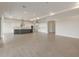 Expansive open-concept living area featuring hardwood floors and recessed lighting, ideal for modern living at 26696 W Siesta Ln, Buckeye, AZ 85396
