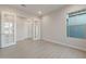 Bright office space featuring a large window and double doors at 26696 W Siesta Ln, Buckeye, AZ 85396