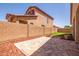 Expansive backyard featuring brick perimeter walls, a stone patio, and low maintenance landscaping at 3107 S 74Th Ln, Phoenix, AZ 85043