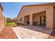Large backyard, including a covered patio, perfect for outdoor dining and relaxation, with a stone patio at 3107 S 74Th Ln, Phoenix, AZ 85043