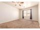 Large bedroom features carpet flooring, neutral walls, and plenty of natural light at 3107 S 74Th Ln, Phoenix, AZ 85043