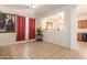 Open dining area with tiled floors, decorative painting, and natural light from the window at 3107 S 74Th Ln, Phoenix, AZ 85043