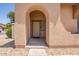 Inviting covered entryway featuring a secure front door with a stylish sunburst design at 3107 S 74Th Ln, Phoenix, AZ 85043