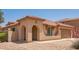 Inviting single-story home featuring a charming arched entryway and a well-maintained desert landscape at 3107 S 74Th Ln, Phoenix, AZ 85043