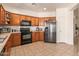 Efficient kitchen layout featuring modern appliances, ample counter space, and tile flooring at 3107 S 74Th Ln, Phoenix, AZ 85043