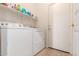 Laundry room featuring a washer, dryer, and overhead shelf storage at 3107 S 74Th Ln, Phoenix, AZ 85043