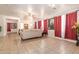 Spacious living room boasts tiled floors and large wall art, creating a welcoming atmosphere at 3107 S 74Th Ln, Phoenix, AZ 85043