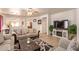 Spacious living room featuring a ceiling fan, stylish sofas, and an elegant area rug at 3107 S 74Th Ln, Phoenix, AZ 85043