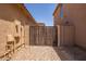 Gated side yard featuring gravel landscaping for easy maintenance and privacy at 3107 S 74Th Ln, Phoenix, AZ 85043