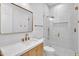 Stylish bathroom featuring a glass shower and a sleek vanity with white countertops and modern fixtures at 3461 E Indigo Cir, Mesa, AZ 85213