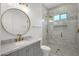 Stylish bathroom features a marble countertop, gold hardware, and a glass-enclosed shower at 3461 E Indigo Cir, Mesa, AZ 85213