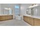 Spacious bathroom with separate and sinks, bathtub, and modern decor at 3461 E Indigo Cir, Mesa, AZ 85213