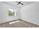Bedroom with neutral carpet, ceiling fan and natural light from window at 3461 E Indigo Cir, Mesa, AZ 85213