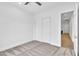 Clean bedroom with double door closet, neutral carpet and ample space at 3461 E Indigo Cir, Mesa, AZ 85213
