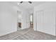 Neutral bedroom with carpet flooring and a view of walk-in closet and stairway at 3461 E Indigo Cir, Mesa, AZ 85213