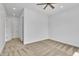 A spacious bedroom with neutral carpet, a ceiling fan, and white walls showcases modern comfort at 3461 E Indigo Cir, Mesa, AZ 85213