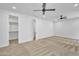 Bright bedroom featuring a walk-in closet and neutral carpeting at 3461 E Indigo Cir, Mesa, AZ 85213