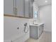Laundry room with gray cabinets, white countertops, patterned flooring, and gold hardware at 3461 E Indigo Cir, Mesa, AZ 85213