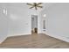 Bright living room with hardwood floors and view of a small adjacent space at 3461 E Indigo Cir, Mesa, AZ 85213