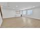 Spacious living room with natural light, bar area, and hardwood floors at 3461 E Indigo Cir, Mesa, AZ 85213