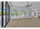 Spacious living room featuring large windows and doors with a view of the backyard at 3461 E Indigo Cir, Mesa, AZ 85213