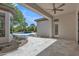 Covered patio features a ceiling fan, tile flooring, and views of the sparkling pool and landscaped backyard at 3461 E Indigo Cir, Mesa, AZ 85213