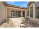 Travertine patio has folding glass doors with views of the landscape and outdoor living space at 3461 E Indigo Cir, Mesa, AZ 85213