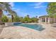 Backyard boasts a gorgeous pool with lush landscaping, creating an idyllic outdoor retreat at 3461 E Indigo Cir, Mesa, AZ 85213