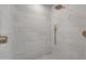 Modern shower detailed with elegant subway tile and sleek gold fixtures for a spa-like experience at 3461 E Indigo Cir, Mesa, AZ 85213