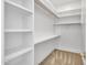 Well-organized walk-in closet offering ample shelving and hanging space for wardrobe storage at 3461 E Indigo Cir, Mesa, AZ 85213