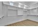 Spacious walk-in closet equipped with custom shelving and rod system, illuminated by natural light at 3461 E Indigo Cir, Mesa, AZ 85213