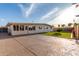 Spacious backyard featuring a well-maintained lawn and a cozy, enclosed patio for relaxed outdoor living at 3632 E Poinsettia Dr, Phoenix, AZ 85028