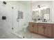 Elegant bathroom with dual sink vanity, glass shower and modern fixtures at 3632 E Poinsettia Dr, Phoenix, AZ 85028
