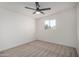 Neutral bedroom features plush carpeting, light walls and trim, and a bright sunny window at 3632 E Poinsettia Dr, Phoenix, AZ 85028