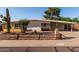 Charming single-story home featuring desert landscaping and a cozy, covered porch entry at 3632 E Poinsettia Dr, Phoenix, AZ 85028