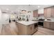 Open-concept kitchen featuring a large island, modern appliances, and seamless flow to living areas at 3632 E Poinsettia Dr, Phoenix, AZ 85028
