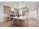 Bright kitchen boasts a large island, modern cabinetry, and stylish pendant lighting at 3632 E Poinsettia Dr, Phoenix, AZ 85028