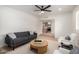 Living room features modern decor, neutral color scheme, and seamless flow to kitchen at 3632 E Poinsettia Dr, Phoenix, AZ 85028