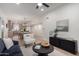 Bright living room connects to the dining area and kitchen, featuring modern decor, and neutral tones at 3632 E Poinsettia Dr, Phoenix, AZ 85028